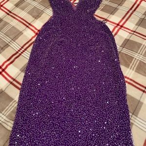 Purple sequined gown.
